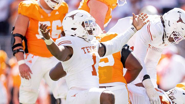 Texas Longhorns edge Colin Simmons (1) celebrates after Tennessee quarterback Faizon Brandon (11) is sacked again during a college football game between Tennessee and Texas at Neyland Stadium in Knoxville, Tenn. on Sept. 26, 2026. Texas Longhorns edge Colin Simmons (1) celebrates after Tennessee quarterback Faizon Brandon (11) is sacked again during a college football game between Tennessee and Texas at Neyland Stadium in Knoxville, Tenn. on Sept. 26, 2026.