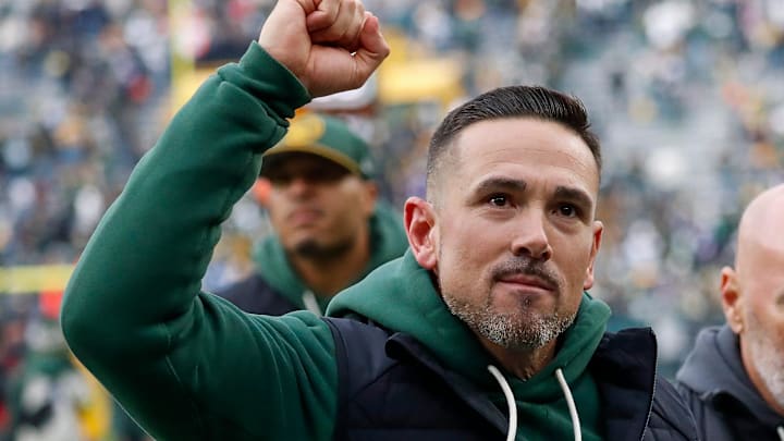 Green Bay Packers coach Matt LaFleur pumps his fist as he runs off the field after defeating the Minnesota Vikings on Nov. 23.