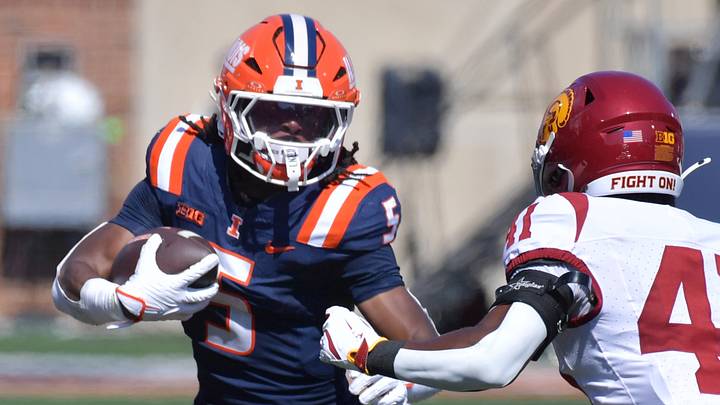 Sep 27, 2025; Champaign, Illinois, USA; Illinois Fighting Illini running back Ca'Lil Valentine (5) runs the ball as Southern California Trojans safety Kendarius Reddick (41) defends during the first half at Memorial Stadium. Mandatory Credit: Ron Johnson-Imagn Images Sep 27, 2025; Champaign, Illinois, USA; Illinois Fighting Illini running back Ca'Lil Valentine (5) runs the ball as Southern California Trojans safety Kendarius Reddick (41) defends during the first half at Memorial Stadium. Mandatory Credit: Ron Johnson-Imagn Images