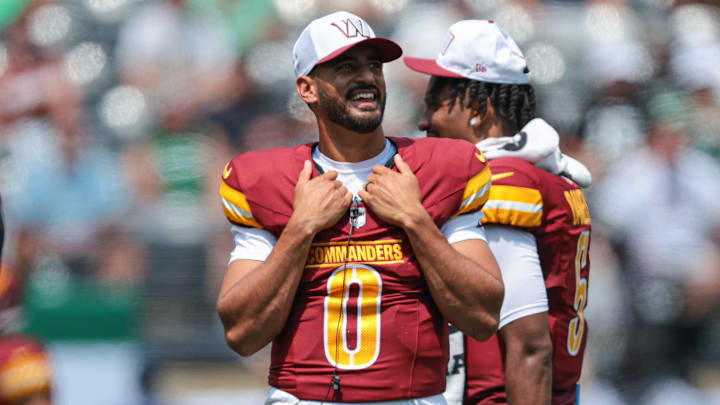 Aug 10, 2024; East Rutherford, New Jersey, USA; Washington Commanders quarterback Marcus Mariota (0) looks on during the first half against the New York Jets at MetLife Stadium. Mandatory Credit: Vincent Carchietta-Imagn Images