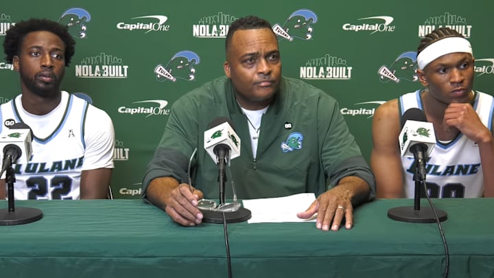 Asher Woods (left), coach Ron Hunter (middle), and Curtis Williams Jr. (right) during a post-game press conference.
