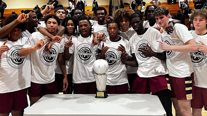 Springdale Prep boys basketball team poses with the trophy after Friday evening’s Maryland Private School state tournament title game. The No. 5 Lions defeated 17th-ranked Clinton Grace Christian School, 62-55, at Eleanor Roosevelt High.