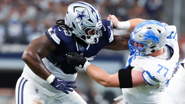 Oct 13, 2024; Arlington, Texas, USA;  Dallas Cowboys defensive tackle Mazi Smith (58) and Detroit Lions center Frank Ragnow (77) battle during the second quarter at AT&T Stadium. Mandatory Credit: Kevin Jairaj-Imagn Images