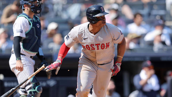 Sep 14, 2024; Bronx, New York, USA; Boston Red Sox third baseman Rafael Devers (11) follows through on a two run single against the New York Yankees during the fifth inning at Yankee Stadium.