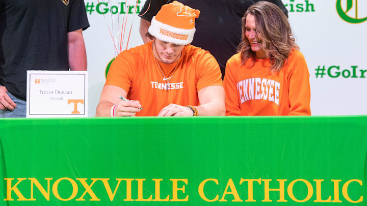 Knoxville Catholic's Trevor Duncan signs with the University of Tennessee for football during a signing day event held at Catholic on Wednesday, Dec. 21, 2022.
Kns Preps Knox Catholic Signing Day Bp Knoxville Catholic's Trevor Duncan signs with the University of Tennessee for football during a signing day event held at Catholic on Wednesday, Dec. 21, 2022.
Kns Preps Knox Catholic Signing Day Bp