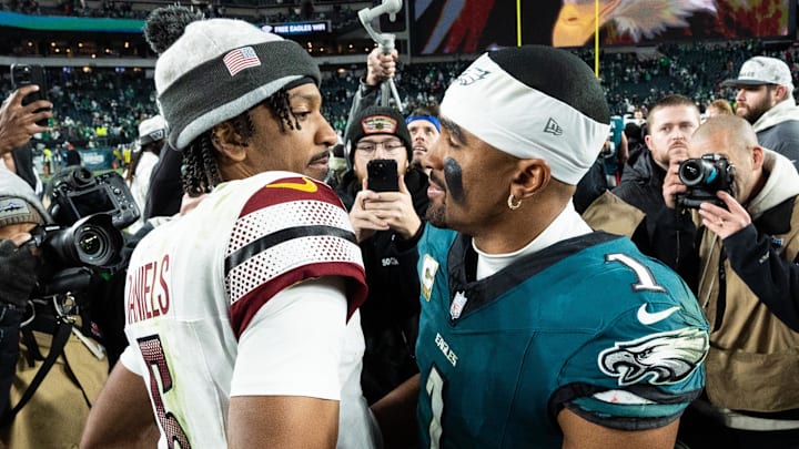 Nov 14, 2024; Philadelphia, Pennsylvania, USA; Philadelphia Eagles quarterback Jalen Hurts (1) and Washington Commanders quarterback Jayden Daniels (5) shake hands after an Eagles victory at Lincoln Financial Field. Mandatory Credit: Bill Streicher-Imagn Images