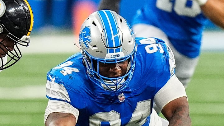 Detroit Lions defensive tackle Mekhi Wingo (94) picks up a fumble by former Pittsburgh Steelers quarterback Kyle Allen (4) Detroit Lions defensive tackle Mekhi Wingo (94) picks up a fumble by former Pittsburgh Steelers quarterback Kyle Allen (4)