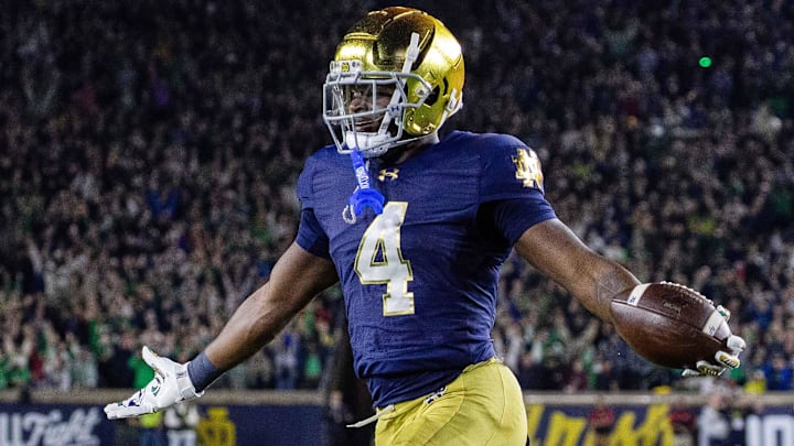 Oct 18, 2025; South Bend, Indiana, USA; Notre Dame Fighting Irish running back Jeremiyah Love (4) runs the ball for a touchdown in the first half against the Southern California Trojans at Notre Dame Stadium. Mandatory Credit: Trevor Ruszkowski-Imagn Images