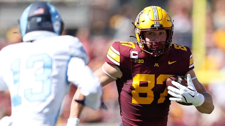Sep 7, 2024; Minneapolis, Minnesota, USA; Minnesota Golden Gophers tight end Nick Kallerup (87) runs with the ball after making a catch against the Rhode Island Rams during the first half at Huntington Bank Stadium.