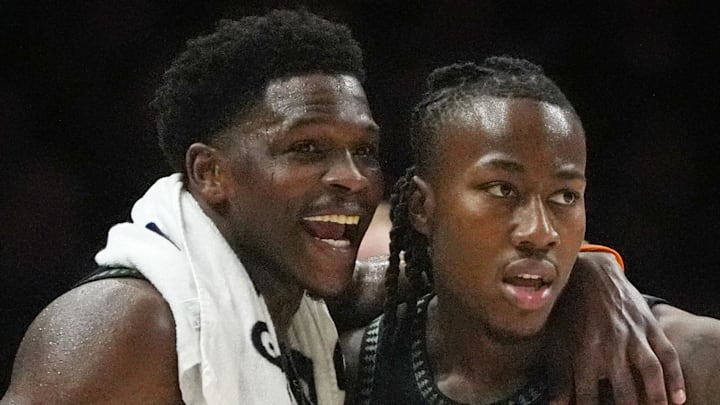 Apr 23, 2026; Minneapolis, Minnesota, USA; Minnesota Timberwolves guard Anthony Edwards (5) talks with guard Ayo Dosunmu (13) during a free throw by the Denver Nuggets in the first quarter at Target Center. Mandatory Credit: Bruce Kluckhohn-Imagn Images