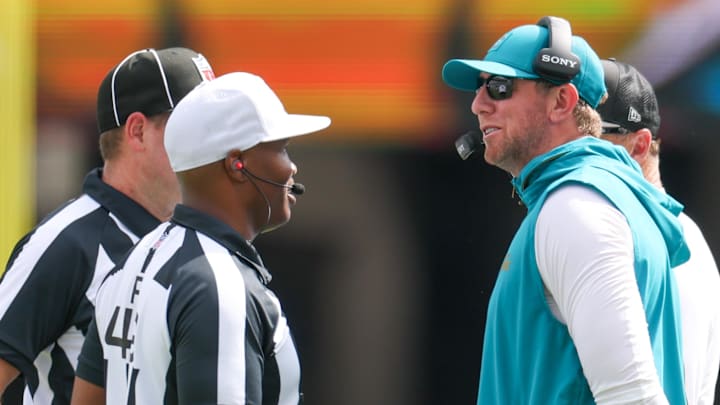 Sep 7, 2025; Jacksonville, Florida, USA;  Jacksonville Jaguars head coach Liam Coen talks with Referee Alex Moore during the first half of a game against the Carolina Panthers at EverBank Stadium. Mandatory Credit: Nathan Ray Seebeck-Imagn Images