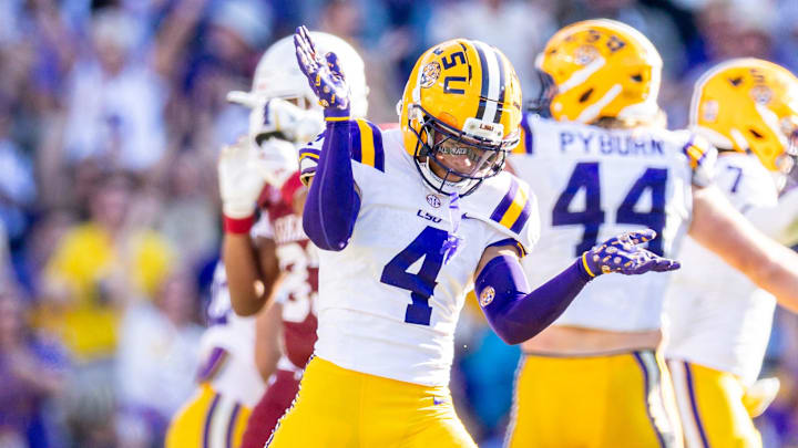 LSU Tigers cornerback Mansoor Delane reacts to a stop on fourth down against the Arkansas Razorbacks LSU Tigers cornerback Mansoor Delane reacts to a stop on fourth down against the Arkansas Razorbacks