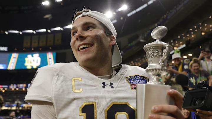 Jan 2, 2025; New Orleans, LA, USA; Notre Dame Fighting Irish quarterback Riley Leonard (13) celebrates with fans in the stands after defeating the Georgia Bulldogs at Caesars Superdome. Jan 2, 2025; New Orleans, LA, USA; Notre Dame Fighting Irish quarterback Riley Leonard (13) celebrates with fans in the stands after defeating the Georgia Bulldogs at Caesars Superdome.