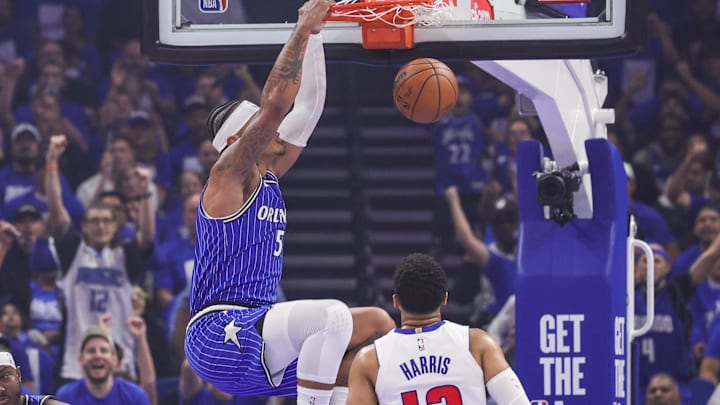 Apr 27, 2026; Orlando, Florida, USA; Orlando Magic forward Paolo Banchero (5) dunks in front of Detroit Pistons forward Tobias Harris (12) during the first quarter during game four of the first round of the 2026 NBA Playoffs at Kia Center. Mandatory Credit: Mike Watters-Imagn Images