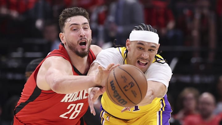 Apr 24, 2026; Houston, Texas, USA; Houston Rockets center Alperen Sengun (28) attempts to steal the ball from Los Angeles Lakers center/forward Jaxson Hayes (11) during the first quarter during game three of the first round of the 2026 NBA Playoffs at Toyota Center. Mandatory Credit: Troy Taormina-Imagn Images