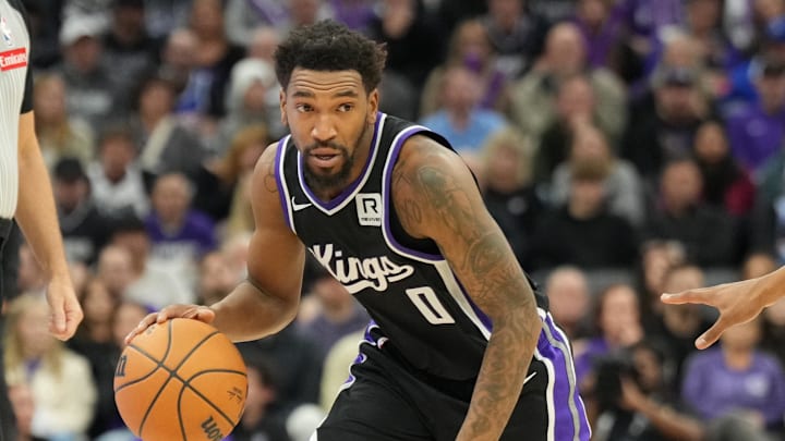 Dec 26, 2024; Sacramento, California, USA; Sacramento Kings guard Malik Monk (0) controls the ball against Detroit Pistons guard Jaden Ivey (23) during the fourth quarter at Golden 1 Center. Mandatory Credit: Kelley L Cox-Imagn Images Dec 26, 2024; Sacramento, California, USA; Sacramento Kings guard Malik Monk (0) controls the ball against Detroit Pistons guard Jaden Ivey (23) during the fourth quarter at Golden 1 Center. Mandatory Credit: Kelley L Cox-Imagn Images