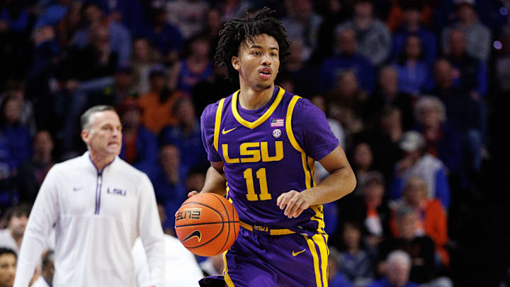 Jan 20, 2026; Gainesville, Florida, USA; Louisiana State Tigers guard Dedan Thomas Jr. (11) dribbles the ball against the Florida Gators during the first half at Exactech Arena at the Stephen C. O'Connell Center. Mandatory Credit: Matt Pendleton-Imagn Images