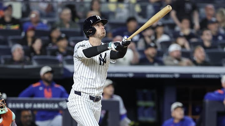 May 18, 2025; Bronx, New York, USA;  New York Yankees left fielder Cody Bellinger (35) hits a grand slam home run in the eighth inning against the New York Mets at Yankee Stadium. Mandatory Credit: Wendell Cruz-Imagn Images