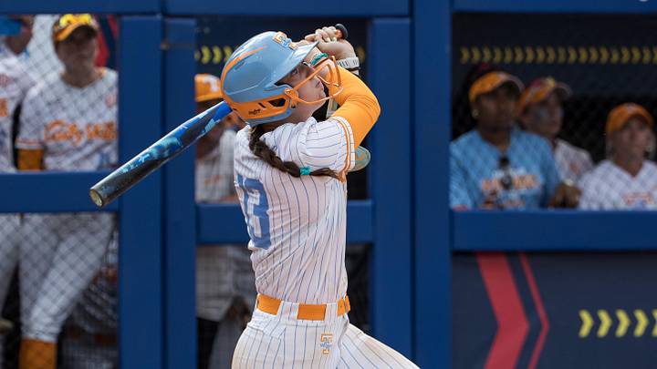 May 30, 2026; Oklahoma City, OK, USA;  Tennessee Lady Volunteers infielder Emma Clarke (13) hits a walk-off home run in the ninth inning beating the Texas Tech Red Raiders during the NCAA Women’s College World Series at Devon Park. Mandatory Credit: Brett Rojo-Imagn Images