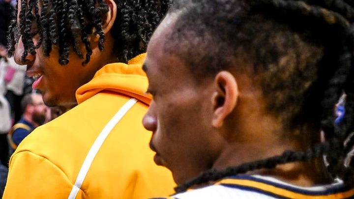 Wayne Memorial's Carlos Medlock Jr., left, shakes hands with Jalahn McClellan after beating Flint Carman-Ainsworth in the Division 1 state semifinal on Friday, March 14, 2025, at the Breslin Center in East Lansing.