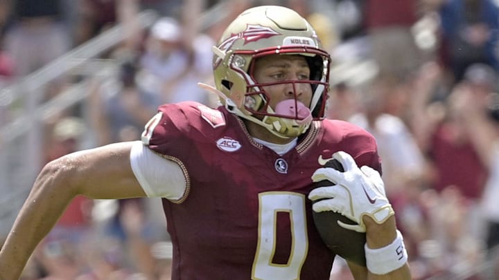 Sep 6, 2025; Tallahassee, Florida, USA; Florida State Seminoles wide receiver Duce Robinson (0) catches a touchdown during the first half against the East Texas A&M at Doak S. Campbell Stadium. Mandatory Credit: Melina Myers-Imagn Images Sep 6, 2025; Tallahassee, Florida, USA; Florida State Seminoles wide receiver Duce Robinson (0) catches a touchdown during the first half against the East Texas A&M at Doak S. Campbell Stadium. Mandatory Credit: Melina Myers-Imagn Images