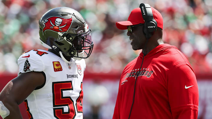 Sep 28, 2025; Tampa, Florida, USA; Tampa Bay Buccaneers outside linebacker Lavonte David (54) speaks with head coach Todd Bowles during the second quarter at Raymond James Stadium. Mandatory Credit: Kim Klement Neitzel-Imagn Images
