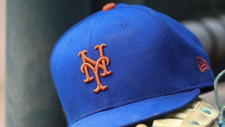 Jul 13, 2022; Atlanta, Georgia, USA; A detailed view of a New York Mets hat and glove in the dugout against the Atlanta Braves in the eighth inning at Truist Park. Jul 13, 2022; Atlanta, Georgia, USA; A detailed view of a New York Mets hat and glove in the dugout against the Atlanta Braves in the eighth inning at Truist Park.
