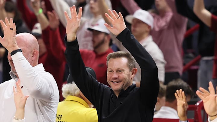 Arkansas Razorbacks coach Ryan Silverfield “Calls the Hogs” during the second half against the James Madison Dukes at Bud Walton Arena. Arkansas won 103-74.