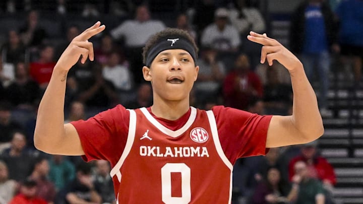Mar 12, 2025; Nashville, TN, USA;  Oklahoma Sooners guard Jeremiah Fears (0) reacts after a three point basket  against the Georgia Bulldogs during the second half at Bridgestone Arena. Mandatory Credit: Steve Roberts-Imagn Images