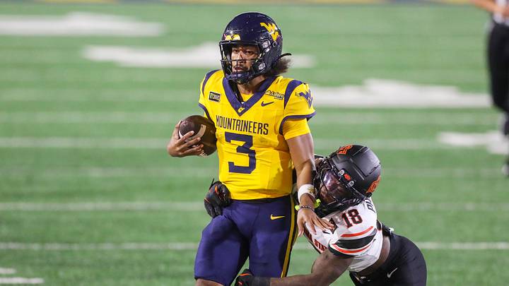 Sep 26, 2026; Morgantown, West Virginia, USA; West Virginia Mountaineers quarterback Michael Hawkins Jr. (3) is knocked out of bounds by Oklahoma State Cowboys safety Mose Phillips III (18) during the third quarter at Milan Puskar Stadium. Mandatory Credit: Ben Queen-Imagn Images Sep 26, 2026; Morgantown, West Virginia, USA; West Virginia Mountaineers quarterback Michael Hawkins Jr. (3) is knocked out of bounds by Oklahoma State Cowboys safety Mose Phillips III (18) during the third quarter at Milan Puskar Stadium. Mandatory Credit: Ben Queen-Imagn Images