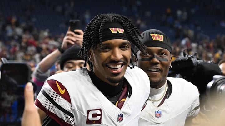 Jan 18, 2025; Detroit, Michigan, USA; Washington Commanders quarterback Jayden Daniels (5) and wide receiver Terry McLaurin (17) celebrate the win against Detroit Lions in a 2025 NFC divisional round game at Ford Field. Mandatory Credit: Lon Horwedel-Imagn Images