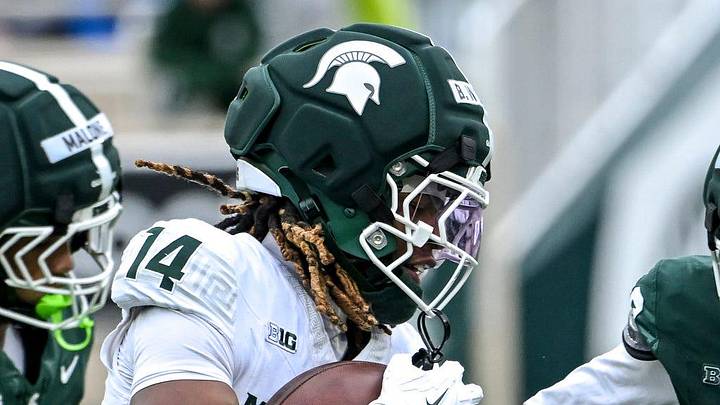 Michigan State's Andrew Brinson IV CB Bryson Williams, center, catches a pass as KJ Deriso, right, closes in during the football Spring Showcase on Saturday, April 18, 2026, at Spartan Stadium in East Lansing.