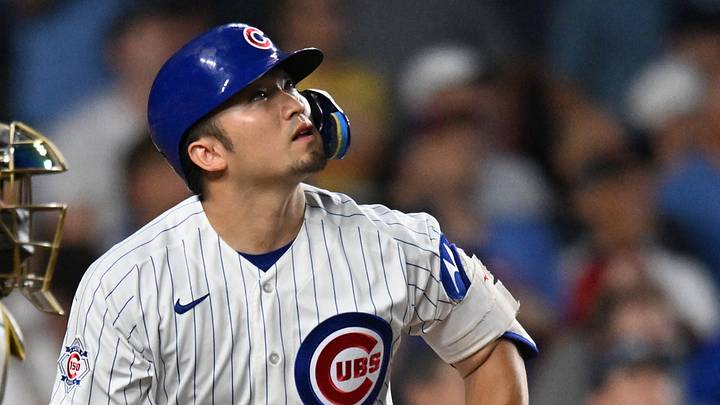 Jun 29, 2026; Chicago, Illinois, USA; Chicago Cubs designated hitter Seiya Suzuki (27) hits a sacrifice RBI against the San Diego Padres during the fifth inning at Wrigley Field. Mandatory Credit: Patrick Gorski-Imagn Images