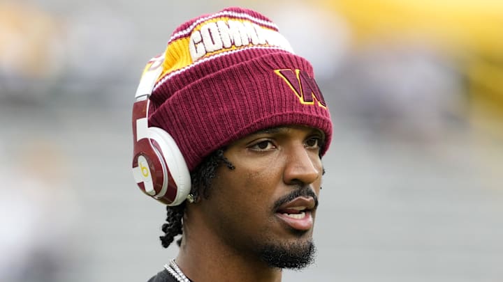 Sep 11, 2025; Green Bay, Wisconsin, USA; Washington Commanders quarterback Jayden Daniels (5) warms up before a game against the Green Bay Packers at Lambeau Field. Mandatory Credit: Jeff Hanisch-Imagn Images