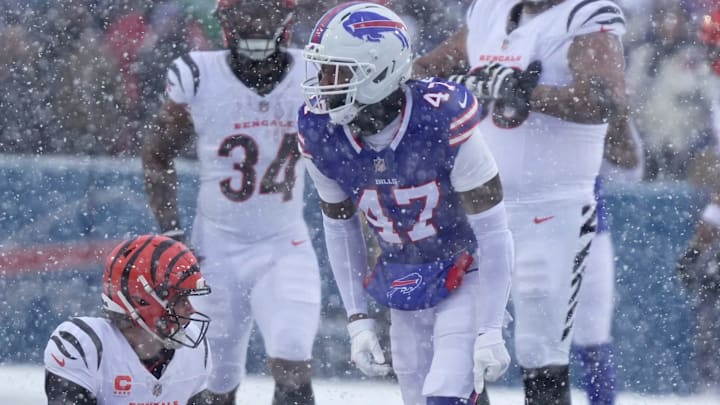 Buffalo Bills cornerback Christian Benford celebrates sacking Cincinnati Bengals quarterback Joe Burrow.