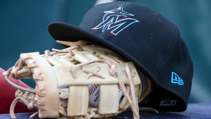 Apr 24, 2024; Atlanta, Georgia, USA; A detailed view of a Miami Marlins hat and glove in the dugout before a game against the Atlanta Braves at Truist Park. Apr 24, 2024; Atlanta, Georgia, USA; A detailed view of a Miami Marlins hat and glove in the dugout before a game against the Atlanta Braves at Truist Park.