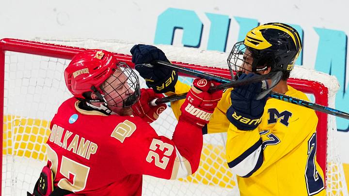 Apr 9, 2026; Las Vegas, Nevada; Denver Pioneers defenseman Eric Pohlkamp checks Michigan Wolverines forward Malcolm Spence in the third period in the semifinals of the NCAA men's ice hockey Frozen Four at T-Mobile Arena. Apr 9, 2026; Las Vegas, Nevada; Denver Pioneers defenseman Eric Pohlkamp checks Michigan Wolverines forward Malcolm Spence in the third period in the semifinals of the NCAA men's ice hockey Frozen Four at T-Mobile Arena.