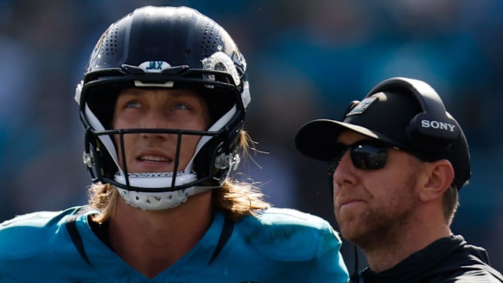 Jacksonville Jaguars quarterback Trevor Lawrence (16) and Jacksonville Jaguars head coach Liam Coen wait to see the result of a challenge during the second quarter in an NFL football AFC Wild Card playoff matchup, Sunday, Jan. 11, 2026, in Jacksonville, Fla. Bills lead 10-7 at the half over the Jaguars. [Doug Engle/Florida Times-Union]