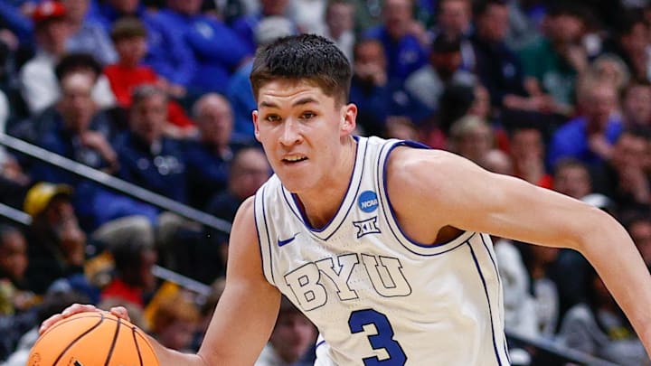 Mar 20, 2025; Denver, CO, USA; Brigham Young Cougars guard Egor Demin (3) drives to the basket against VCU Rams guard Zeb Jackson (2) during the second half in the first round of the NCAA Tournament at Ball Arena. Mandatory Credit: Isaiah J. Downing-Imagn Images