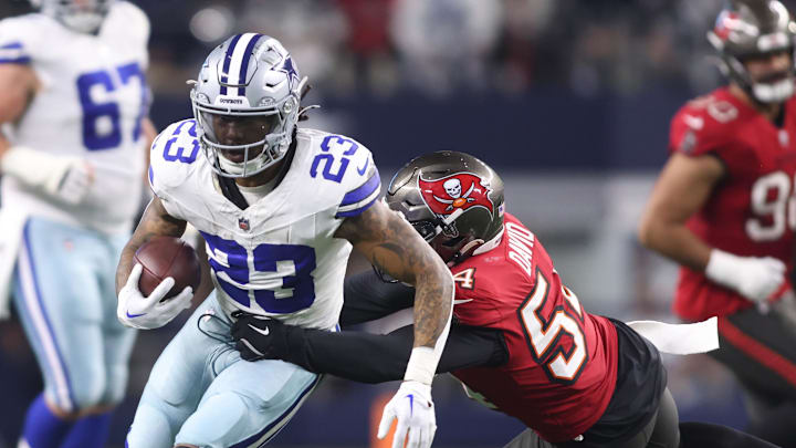 Dec 22, 2024; Arlington, Texas, USA; Dallas Cowboys running back Rico Dowdle (23) runs the ball against the Tampa Bay Buccaneers in the first half at AT&T Stadium. Mandatory Credit: Tim Heitman-Imagn Images Dec 22, 2024; Arlington, Texas, USA; Dallas Cowboys running back Rico Dowdle (23) runs the ball against the Tampa Bay Buccaneers in the first half at AT&T Stadium. Mandatory Credit: Tim Heitman-Imagn Images
