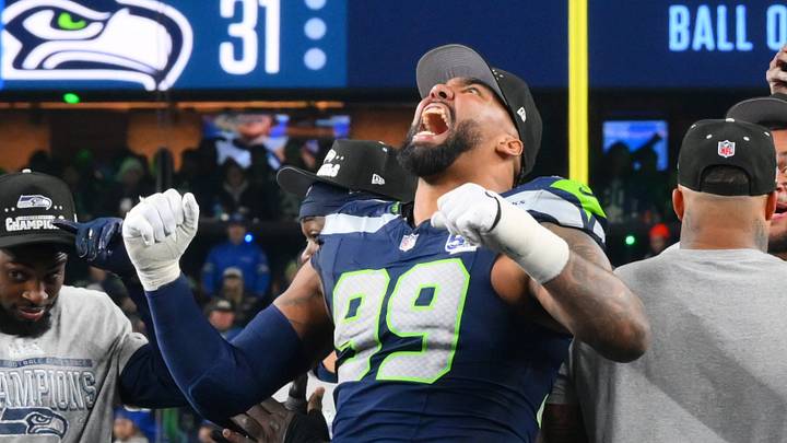 Jan 25, 2026; Seattle, WA, USA; Seattle Seahawks defensive end Leonard Williams (99) celebrates on the podium after defeating the Los Angeles Rams in the 2026 NFC Championship Game at Lumen Field. Mandatory Credit: Steven Bisig-Imagn Images