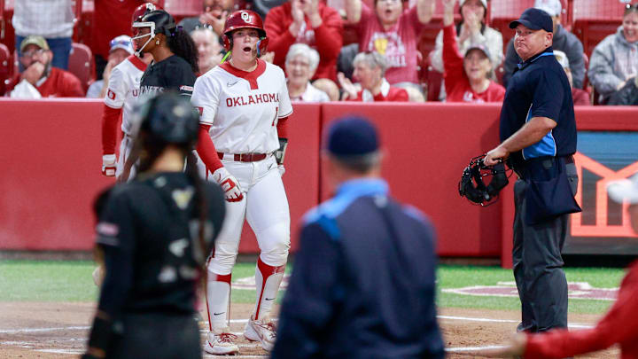 Oklahoma catcher Kendall Wells (1) gets in a pickle and scores during the home opener softball game between Oklahoma and Alabama State at Love’s Field in Norman Okla., on Thursday, Feb. 26, 2026.