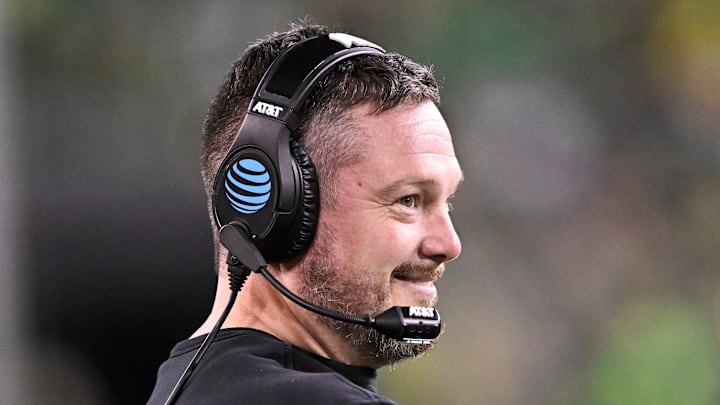 Dec 20, 2025; Eugene, OR, USA;  Oregon Ducks head coach Dan Lanning smiles during the third quarter against the James Madison Dukes at Autzen Stadium. Mandatory Credit: Craig Strobeck-Imagn Images