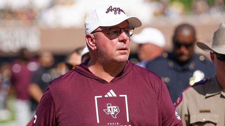 Texas A&M Aggies head coach Mike Elko leaves the field after the first half against the Missouri Tigers during the first half of the game at Faurot Field at Memorial Stadium. Texas A&M Aggies head coach Mike Elko leaves the field after the first half against the Missouri Tigers during the first half of the game at Faurot Field at Memorial Stadium.