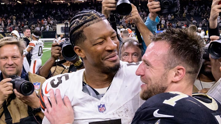 Nov 17, 2024; New Orleans, Louisiana, USA; Cleveland Browns quarterback Jameis Winston (5) hugs his former teammates including New Orleans Saints linebacker Demario Davis (56) and New Orleans Saints tight end Taysom Hill (7) at the end of the game at Caesars Superdome. Mandatory Credit: Matthew Hinton-Imagn Images