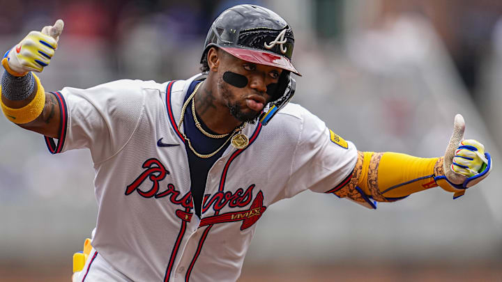 Atlanta Braves right fielder Ronald Acuna Jr (13) reacts after hitting a home run against the Arizona Diamondbacks during the sixth inning at Truist Park.