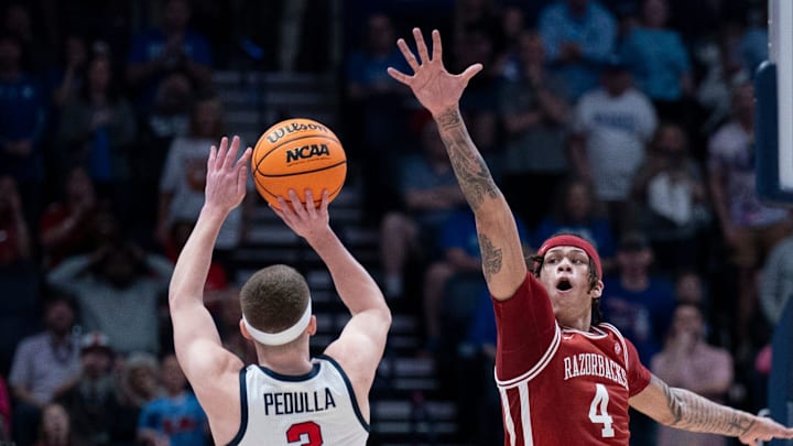 Ole Miss Rebels guard Sean Pedulla (3) shoots over Arkansas Razorbacks forward Trevon Brazile (4) for the game-winning shot during their second round game of the SEC Men's Basketball Tournament at Bridgestone Arena in Nashville, Tenn.