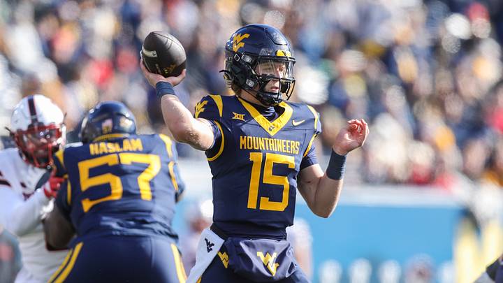 Nov 29, 2025; Morgantown, West Virginia, USA; West Virginia Mountaineers quarterback Scotty Fox Jr. (15) throws a pass during the first quarter against the Texas Tech Red Raiders at Milan Puskar Stadium. Mandatory Credit: Ben Queen-Imagn Images Nov 29, 2025; Morgantown, West Virginia, USA; West Virginia Mountaineers quarterback Scotty Fox Jr. (15) throws a pass during the first quarter against the Texas Tech Red Raiders at Milan Puskar Stadium. Mandatory Credit: Ben Queen-Imagn Images