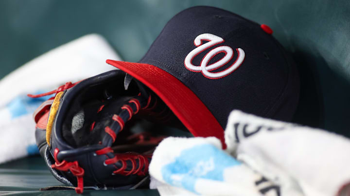 Dark blue Washington Nationals hat on top of black mitt