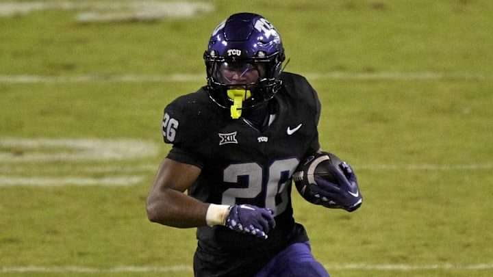 TCU Horned Frogs running back Jeremy Payne (26) runs with the ball during the game between the Horned Frogs and the Bearcats at Amon G. Carter Stadium. TCU Horned Frogs running back Jeremy Payne (26) runs with the ball during the game between the Horned Frogs and the Bearcats at Amon G. Carter Stadium.